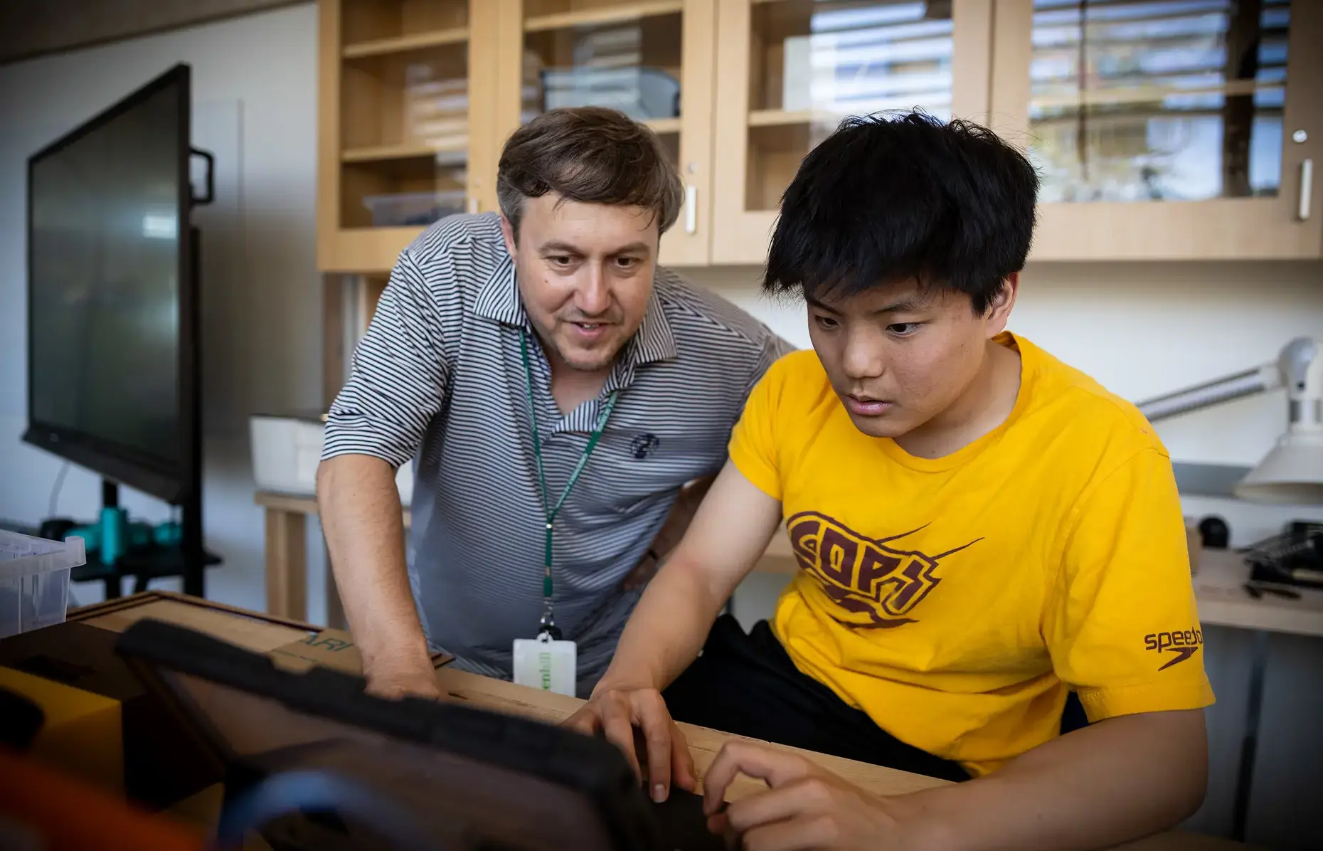 Teacher helping a student