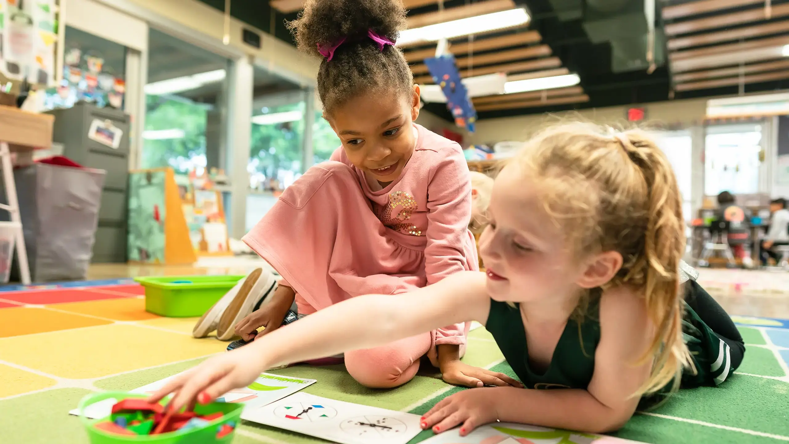 Two girls using manipulatives