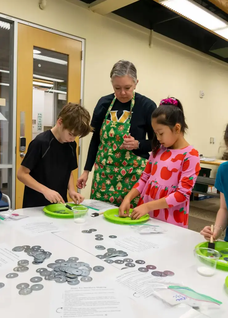 Lower School students making jewelry