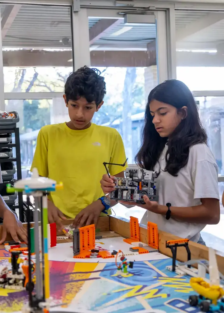 Two students doing robotics