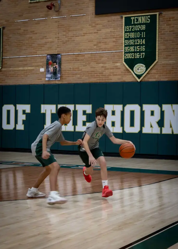 Boys playing basketball