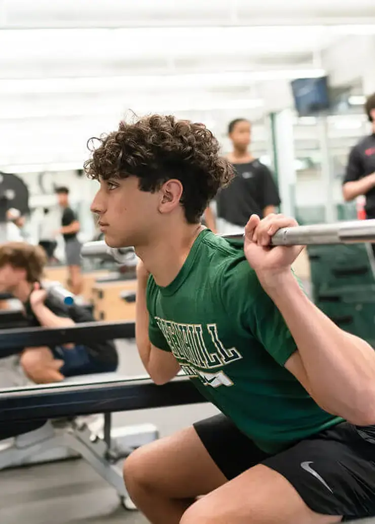 Student lifting weight