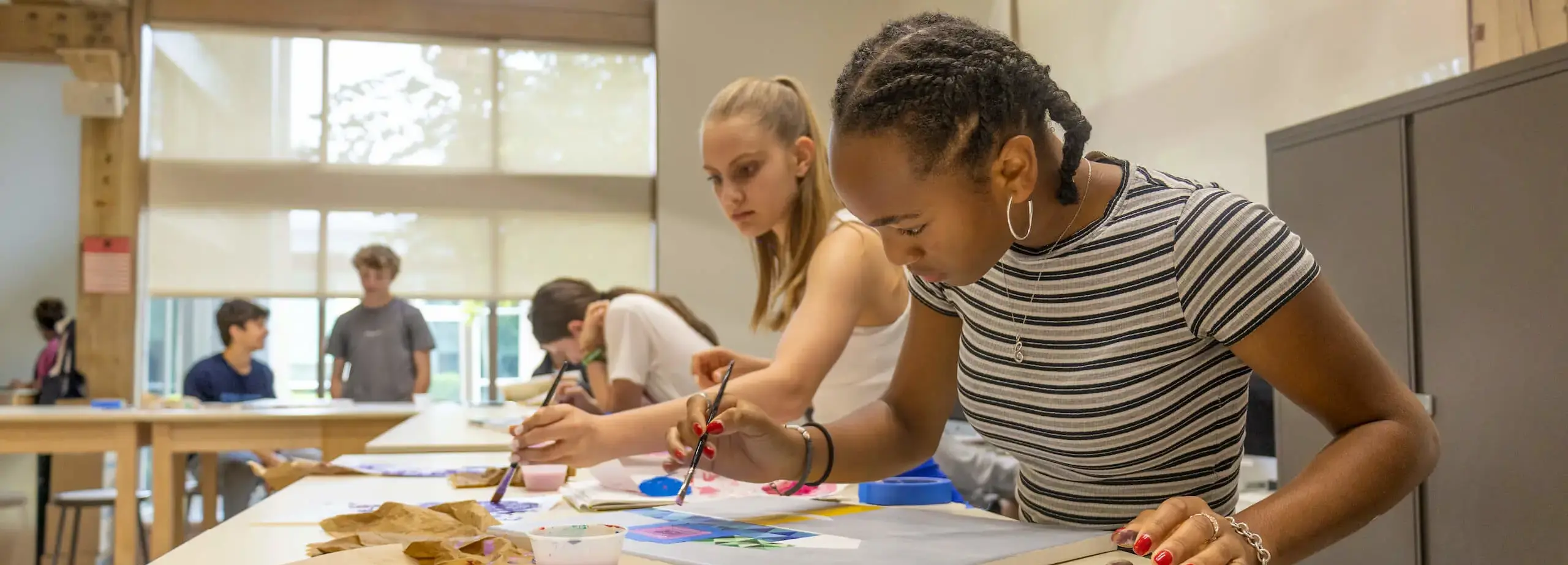 upper school student painting