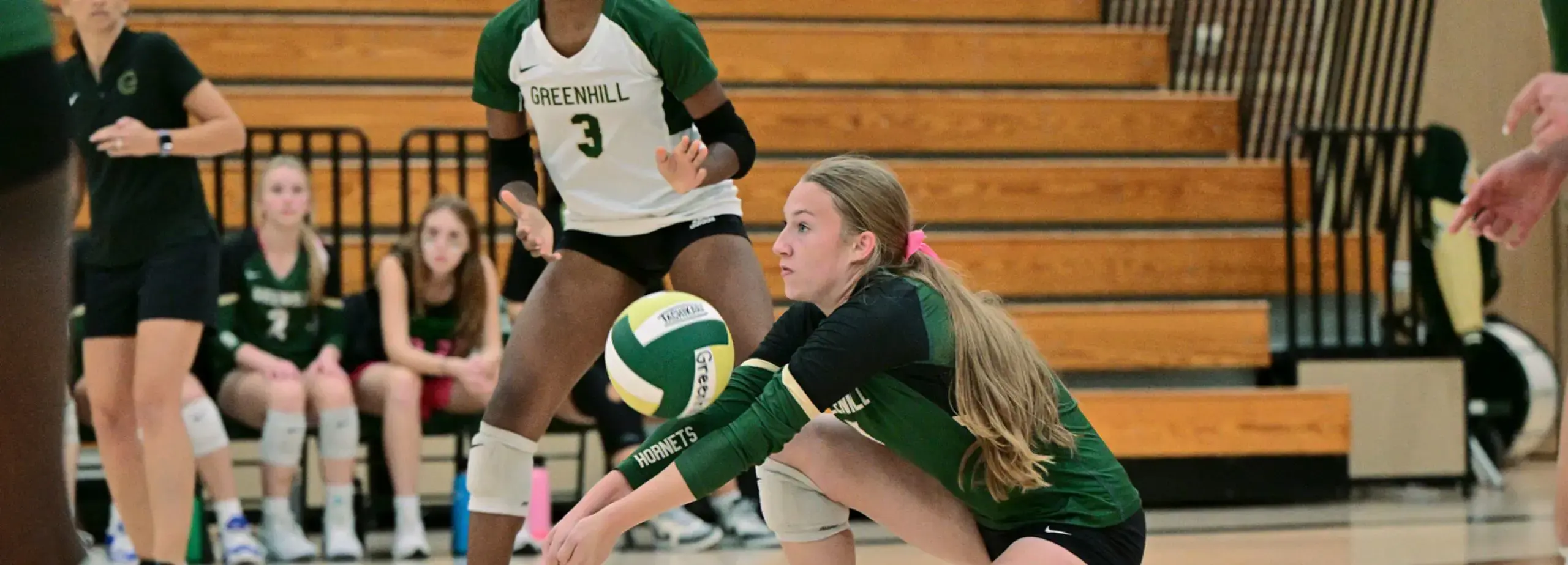 girls playing volleyball